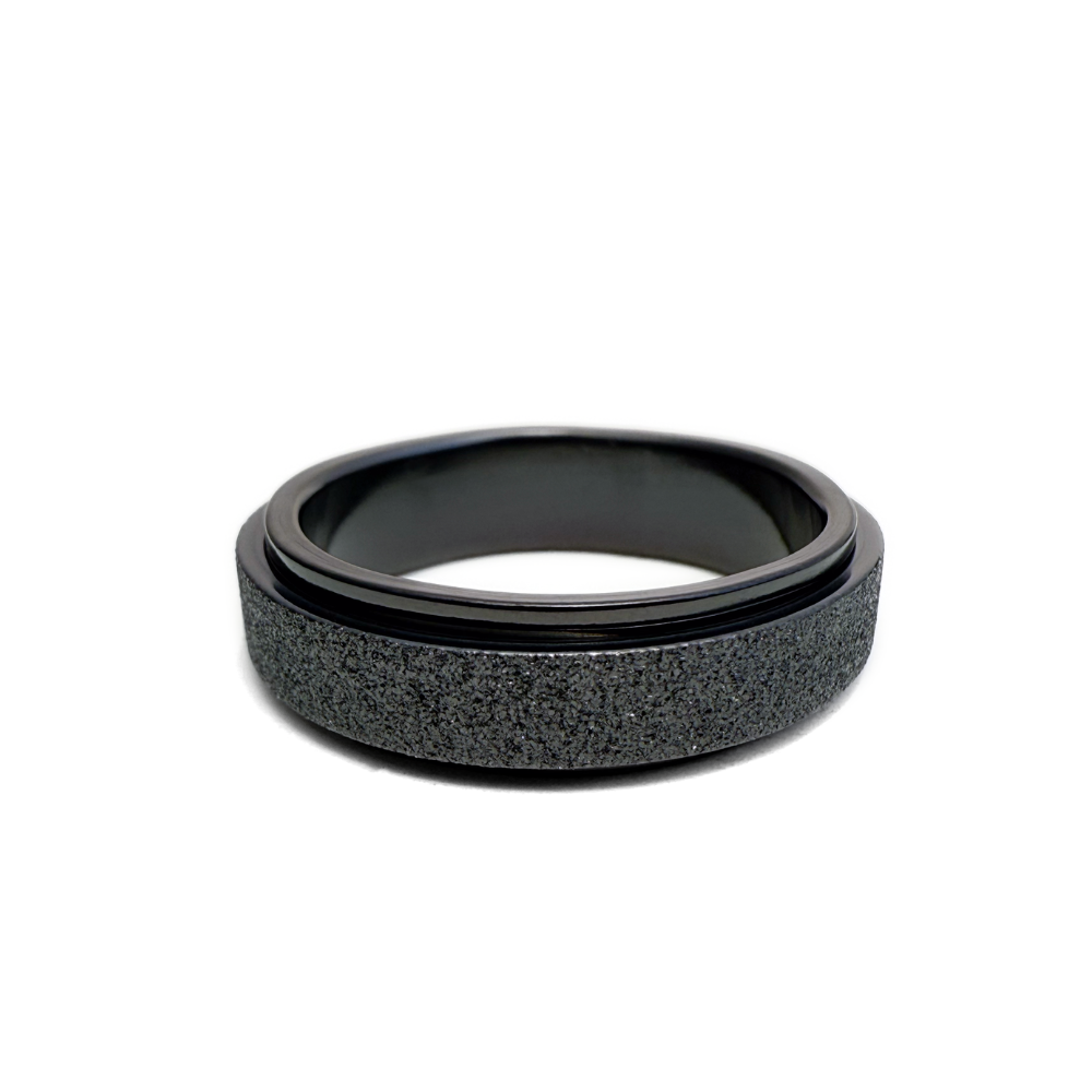 This image features the Seagram Ring, showcasing its sleek and modern design. The ring appears to be made of a dark black material with a smooth finish on the interior for comfort.