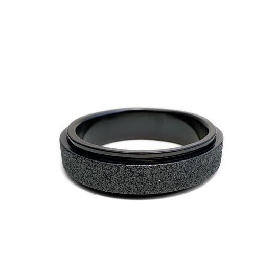 This image features the Seagram Ring, showcasing its sleek and modern design. The ring appears to be made of a dark black material with a smooth finish on the interior for comfort.