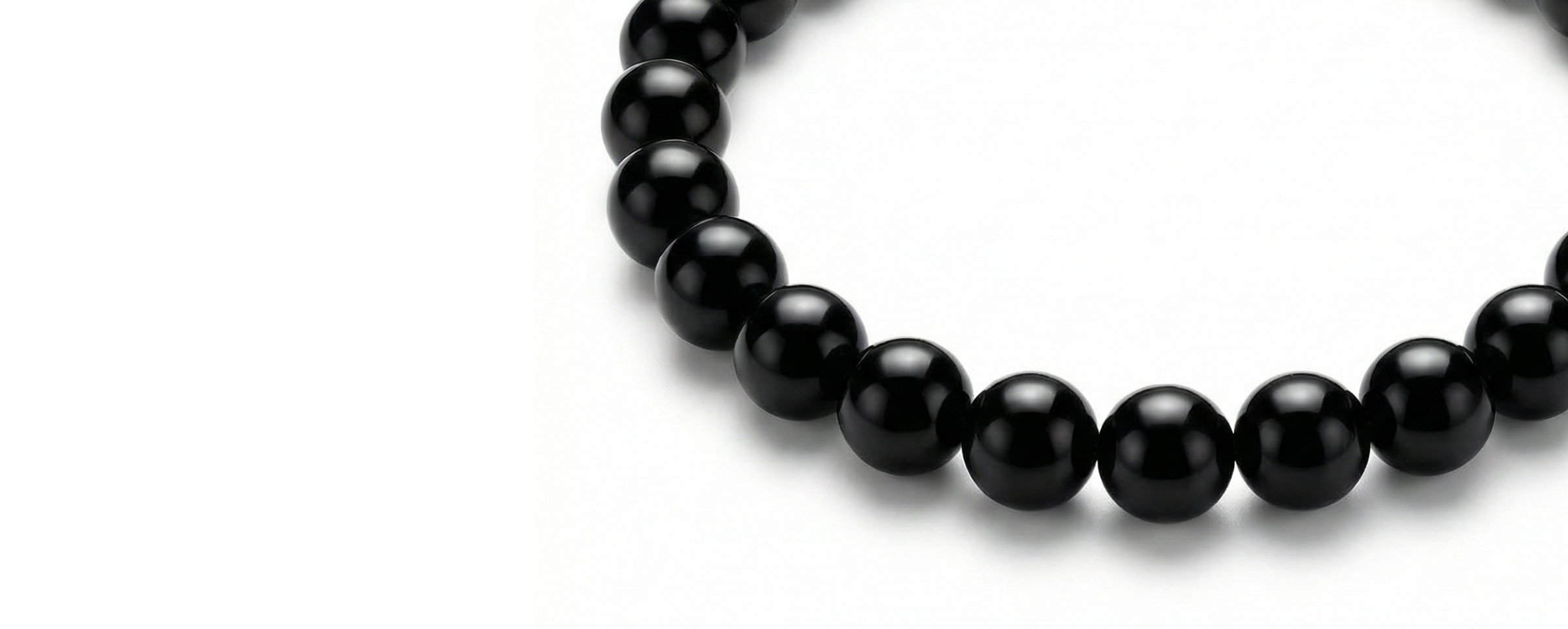 Black beaded bracelet on a white background
