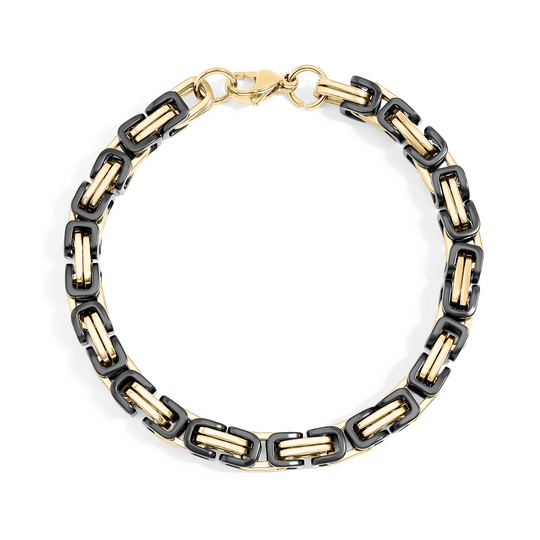 Bracelet with black and gold chain links on a white background