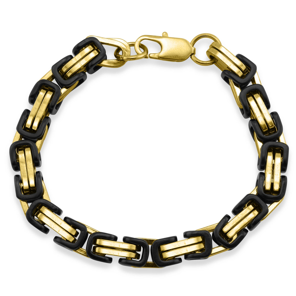 Gold and black chain bracelet on a white background