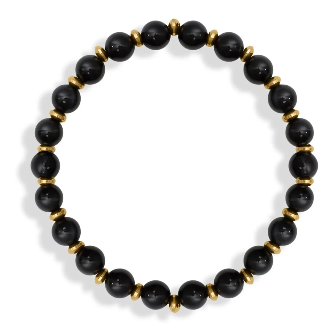 Black beaded bracelet with gold accents on a white background