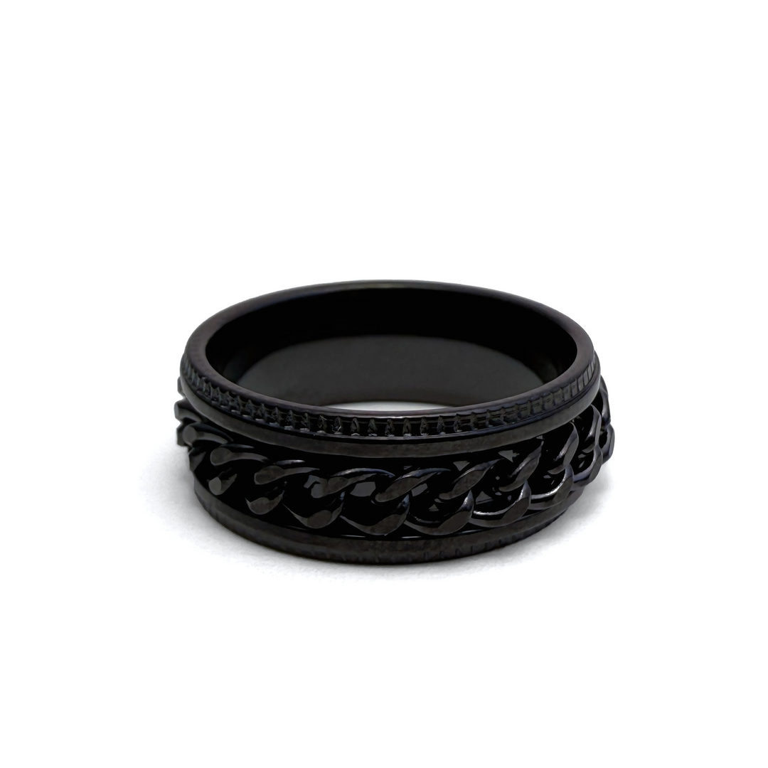 This image features a stylish men's ring, characterized by its all-black color. The ring appears to be made of a polished, smooth black metal 