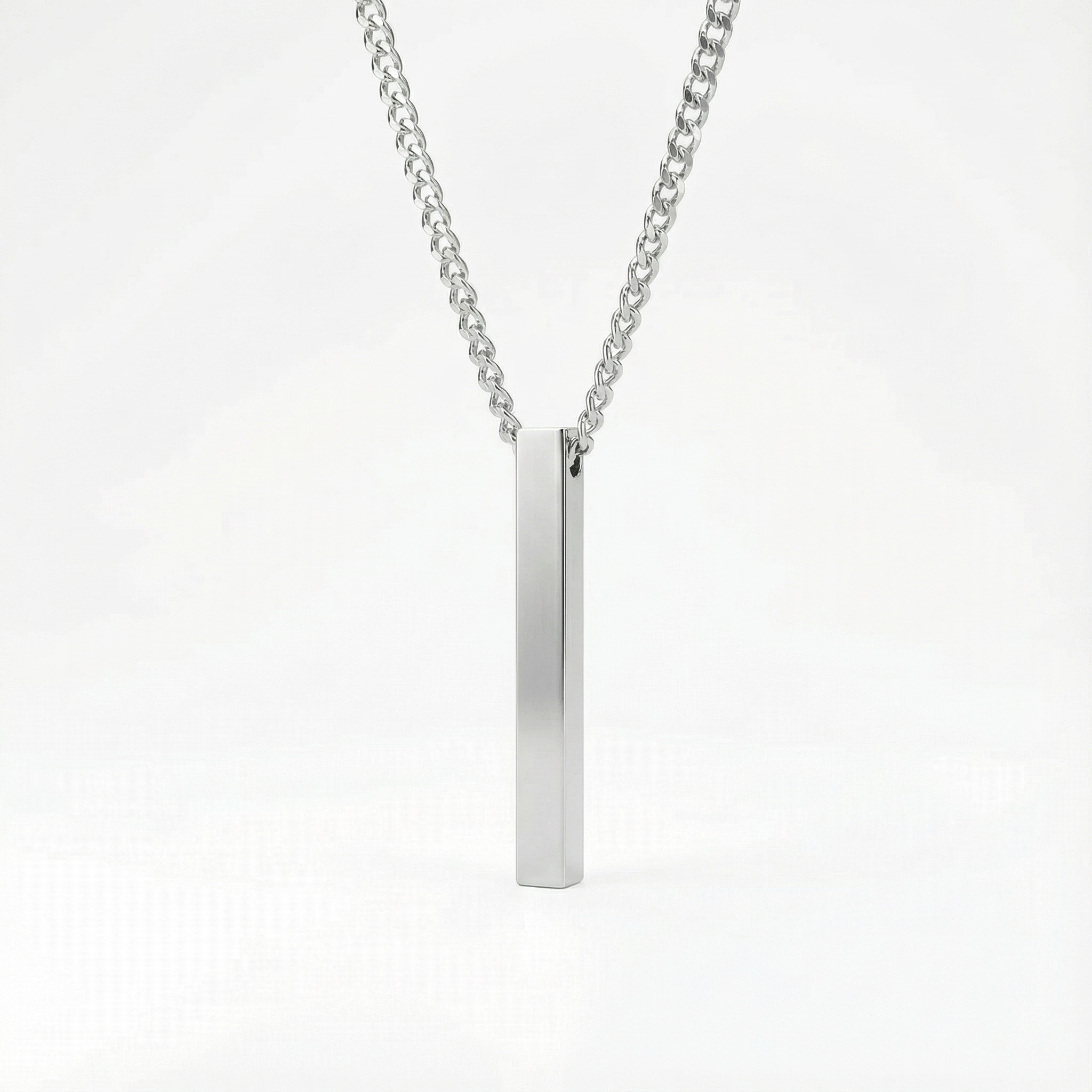 Stainless steel necklace with a vertical bar pendant on a white background