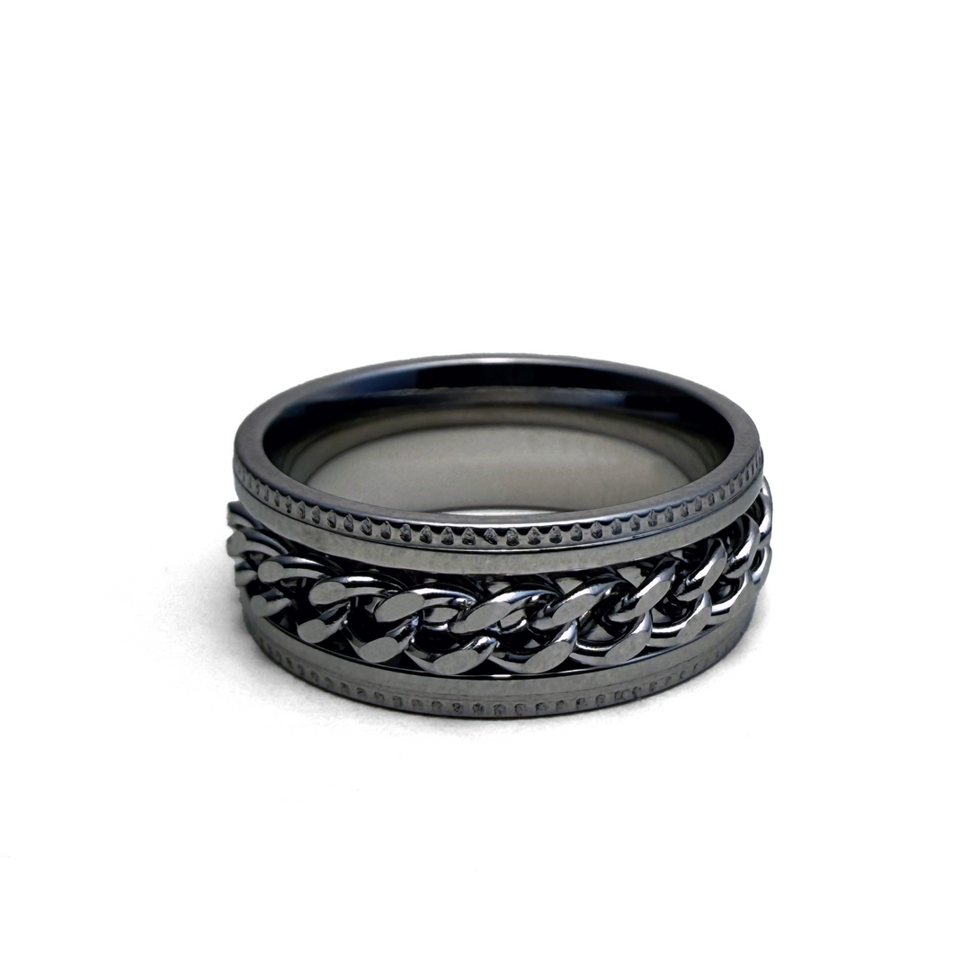 This image features the "Empire Ring," a stylish accessory with a sophisticated design. The ring displays a dual-tone color scheme with a primary dark metallic finish complemented by a contrasting lighter chain-link pattern.