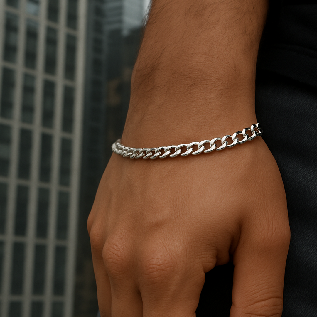 Stainless steel figaro bracelet on a wrist with a blurred background