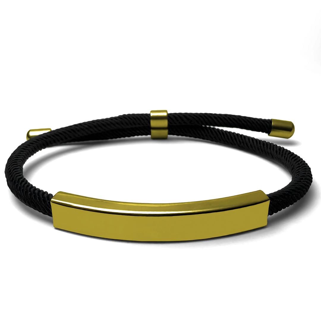 A black and gold bracelet with a solid pattern and metallic clasp.