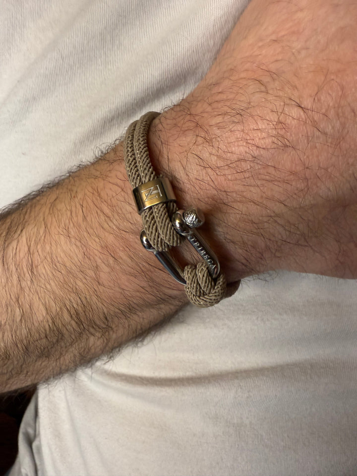 A beige rope bracelet on a man's wrist