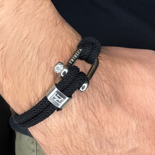 A black rope bracelet on a man's wrist