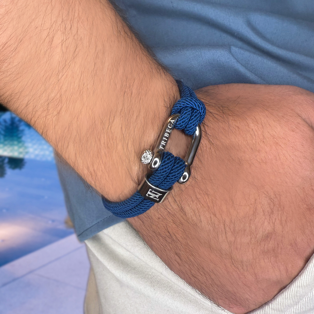 A blue rope bracelet on a man's wrist