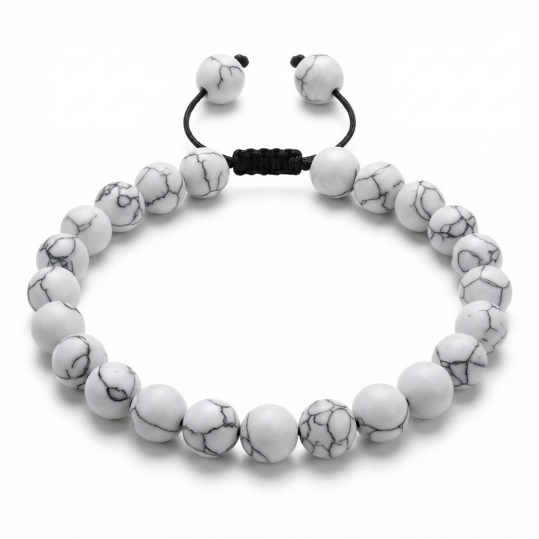 White marbled beaded bracelet with black cord on a white background